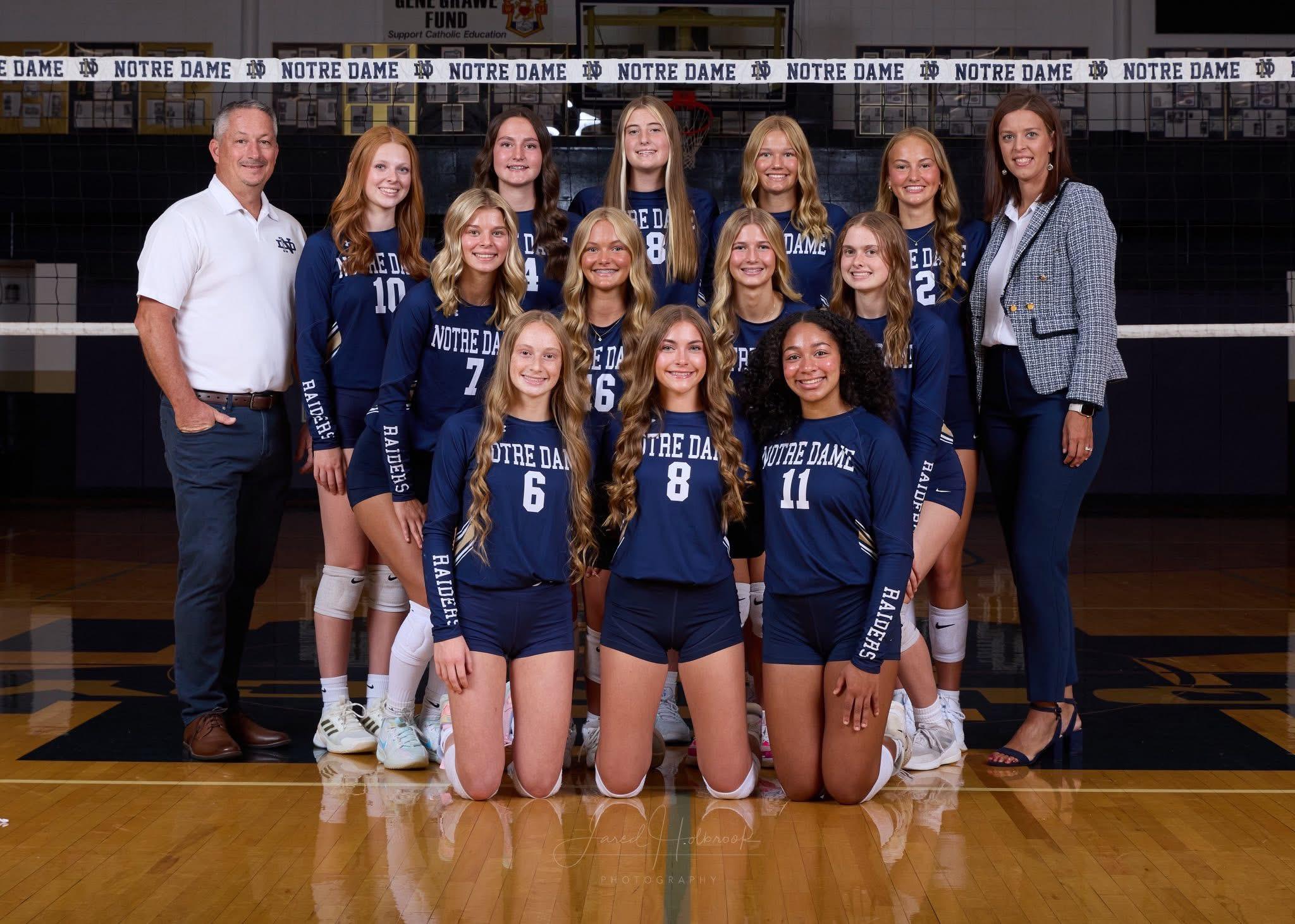 Vball JV 2025 Volleyball players pose for photo in gym.